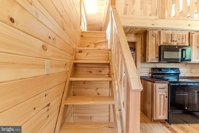 stairs with wood finished floors