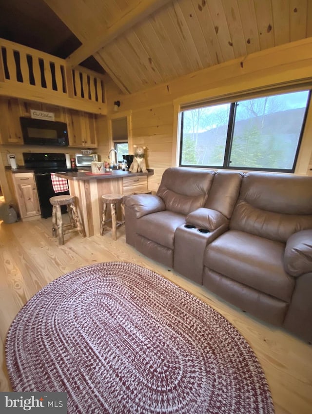 living area featuring light wood-type flooring, wooden ceiling, a toaster, and lofted ceiling with beams