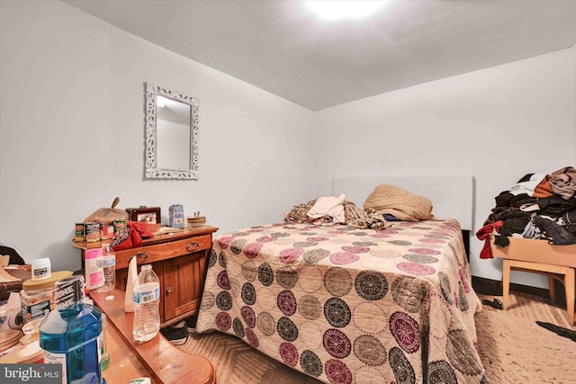 bedroom featuring parquet flooring