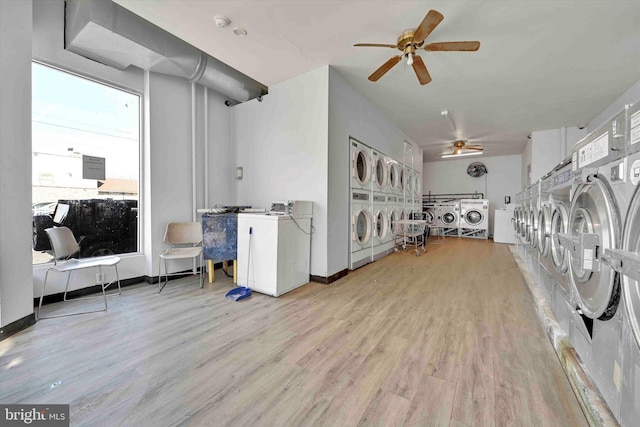 laundry area with ceiling fan, stacked washing maching and dryer, separate washer and dryer, and light hardwood / wood-style floors