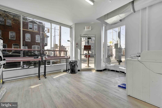 misc room with washer / dryer and hardwood / wood-style floors