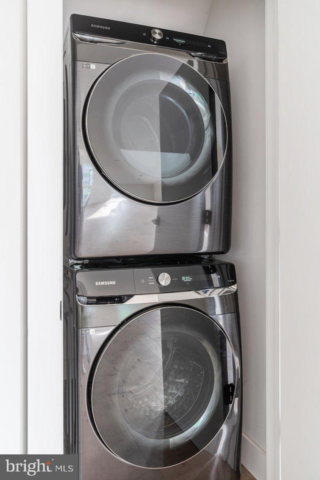 washroom with stacked washer / drying machine