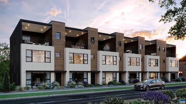 view of outdoor building at dusk