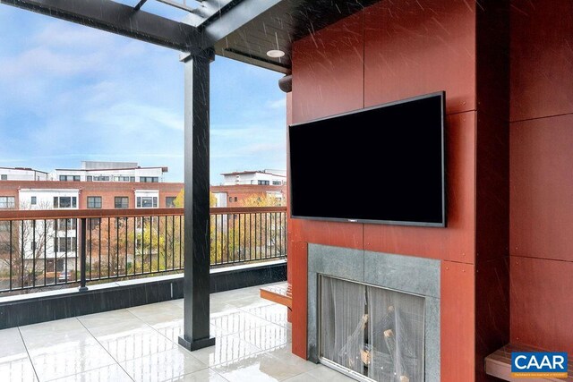 view of patio with a tile fireplace