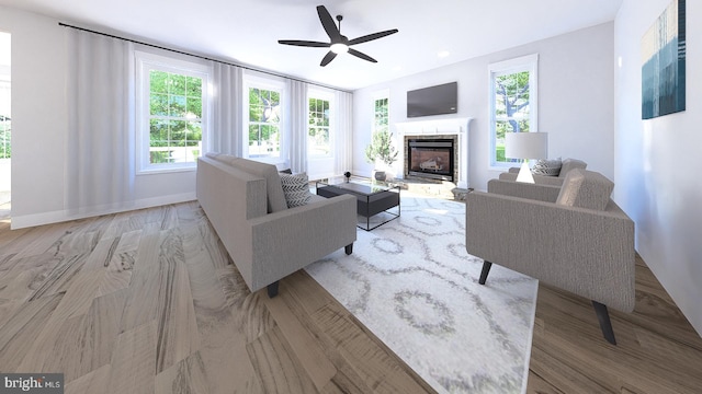 living room featuring light hardwood / wood-style floors and ceiling fan