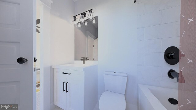 bathroom featuring toilet and vanity