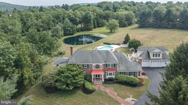 bird's eye view with a water view