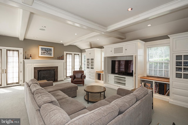 carpeted living room featuring french doors, ornamental molding, and a healthy amount of sunlight