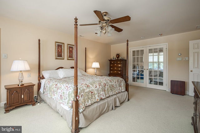 carpeted bedroom featuring french doors and ceiling fan