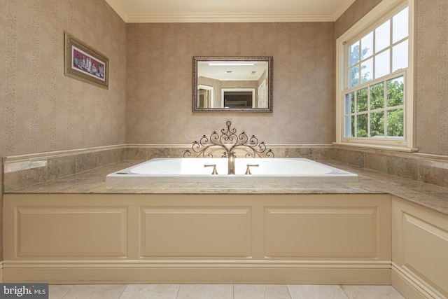 bathroom featuring crown molding, tile patterned flooring, and a washtub