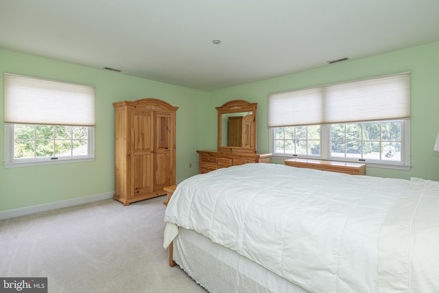 bedroom with light colored carpet