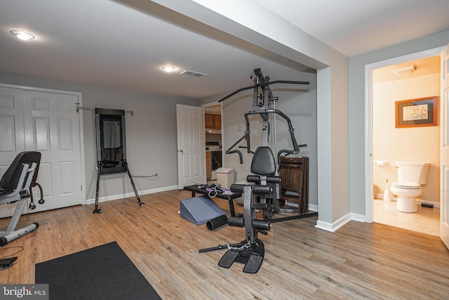 exercise area featuring light hardwood / wood-style floors