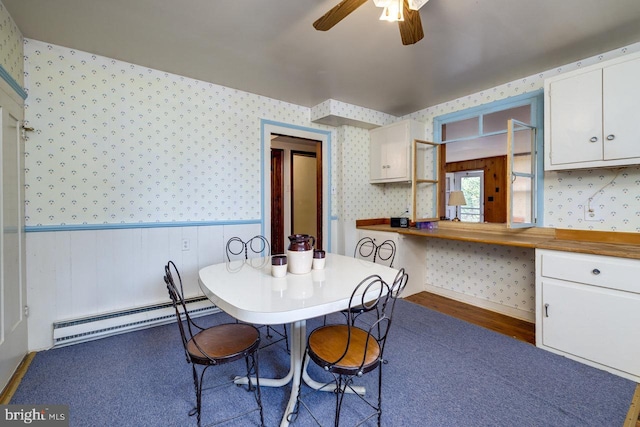 dining area featuring baseboard heating and ceiling fan