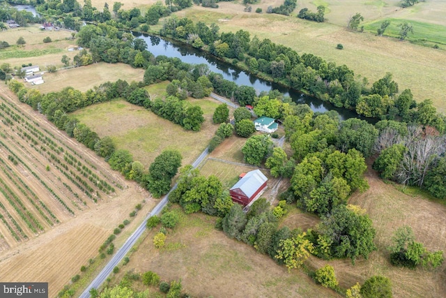 drone / aerial view with a water view and a rural view