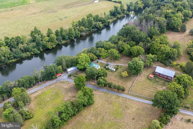 birds eye view of property featuring a rural view and a water view