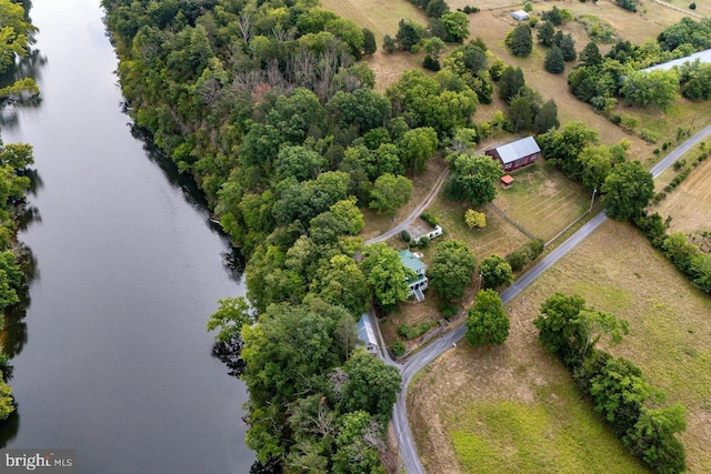 birds eye view of property featuring a rural view and a water view