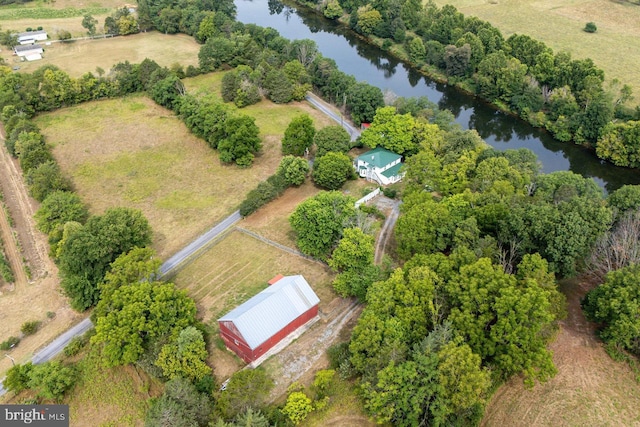 birds eye view of property with a water view and a rural view