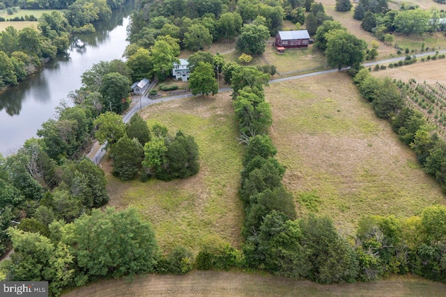 aerial view with a rural view and a water view