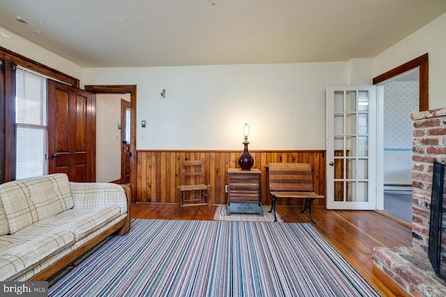 living room with hardwood / wood-style flooring and a fireplace