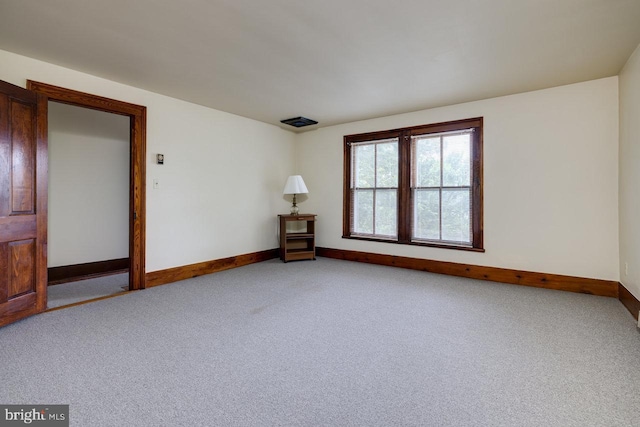 unfurnished room with carpet flooring