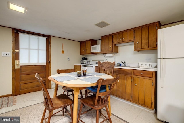 kitchen featuring sink and white appliances