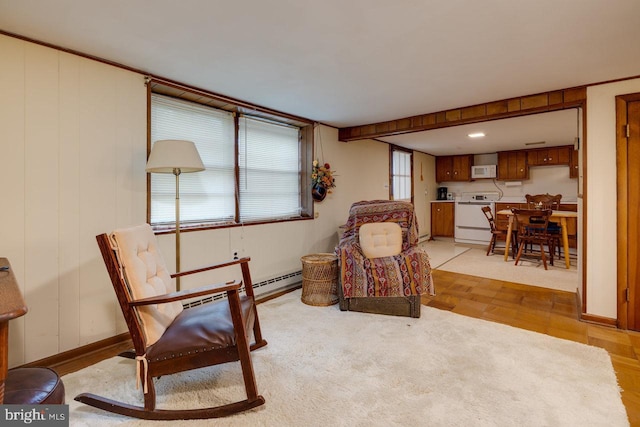 living area featuring light parquet floors and baseboard heating