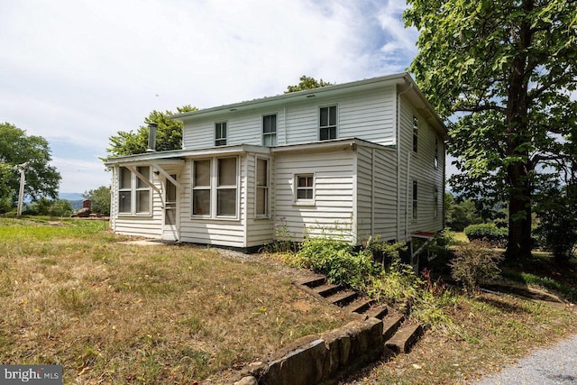 exterior space featuring a front lawn