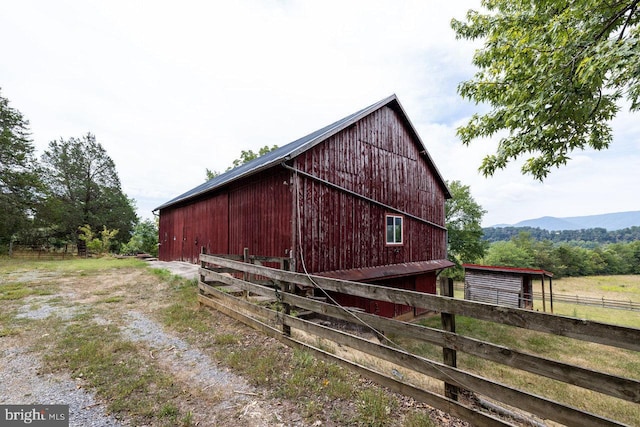 exterior space with an outbuilding and a mountain view