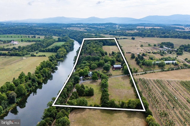 bird's eye view with a water and mountain view and a rural view