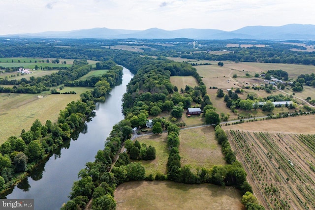 aerial view featuring a rural view and a water and mountain view