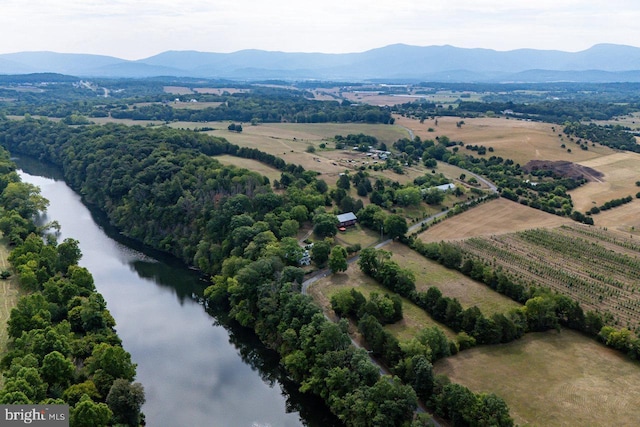 drone / aerial view featuring a water and mountain view and a rural view