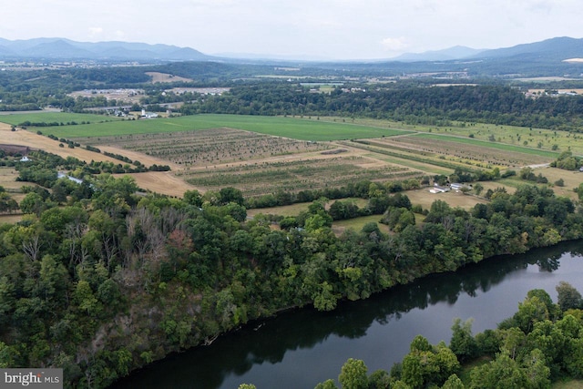 aerial view with a water and mountain view and a rural view