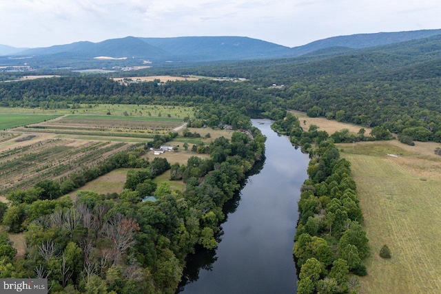 drone / aerial view with a rural view and a water and mountain view