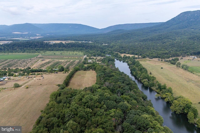 birds eye view of property with a water and mountain view and a rural view