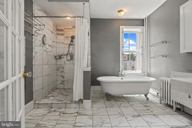 bathroom with plus walk in shower and tile patterned flooring