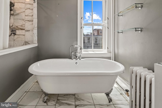 bathroom featuring radiator heating unit, a bathtub, and tile patterned floors