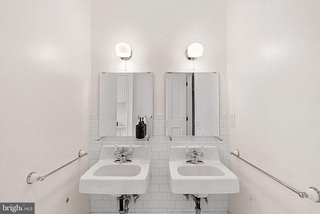 bathroom with tile walls and tasteful backsplash