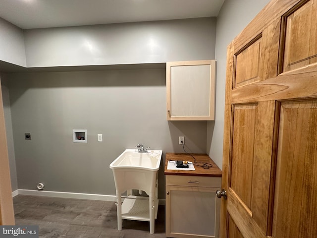 clothes washing area with hookup for a washing machine, cabinets, hookup for an electric dryer, and dark hardwood / wood-style flooring