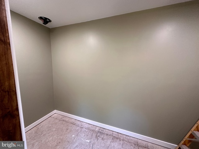 spare room featuring wood-type flooring