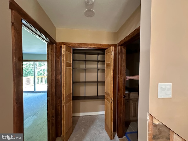 corridor featuring concrete flooring