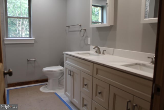 bathroom with vanity and toilet