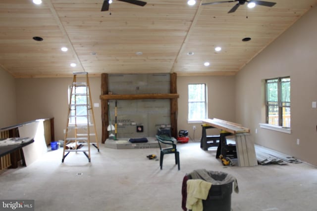 interior space with ceiling fan, a wealth of natural light, and carpet floors