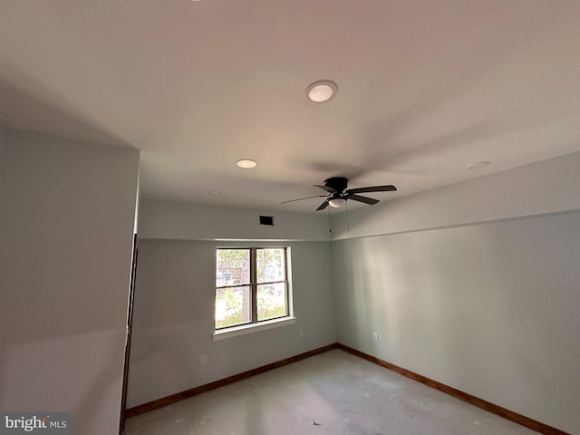 unfurnished room with concrete flooring and ceiling fan