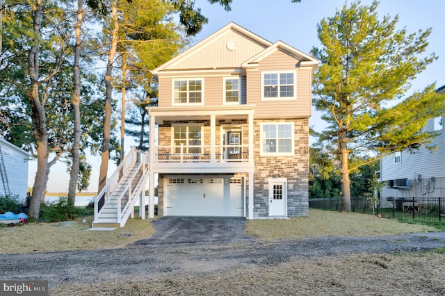 view of front facade featuring a porch and a garage