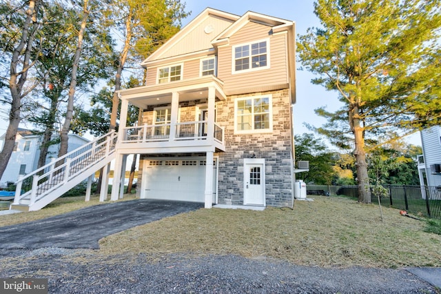 view of front of home featuring a garage and covered porch