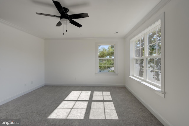 carpeted empty room with ornamental molding and ceiling fan