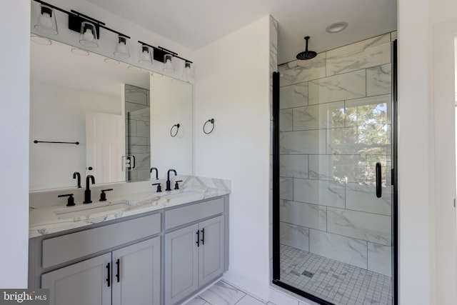 bathroom featuring vanity and a shower with door