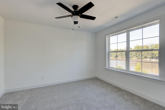 carpeted empty room with ceiling fan