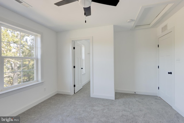 unfurnished bedroom featuring light colored carpet and ceiling fan