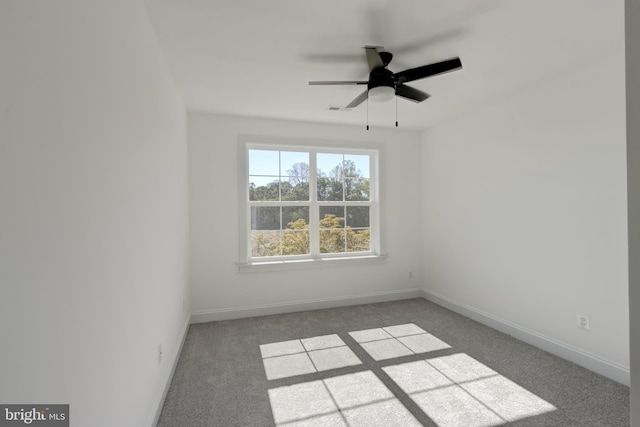 spare room with carpet flooring and ceiling fan